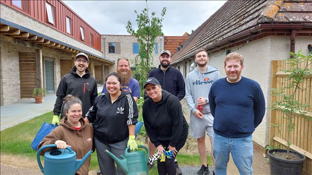 Group shot with gardening equipment 3
