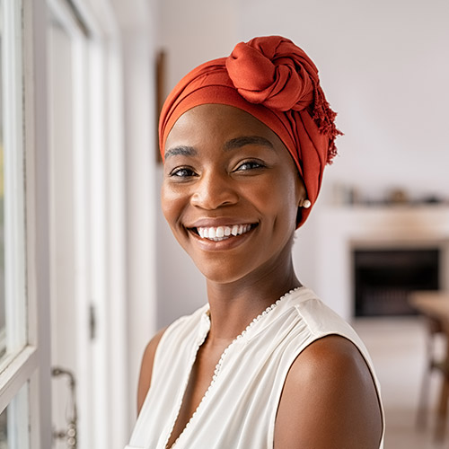 A smiling woman in her home