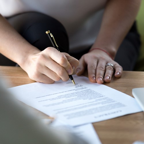 Person signing a form