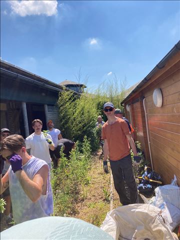 Tom Ryan Matt Louis Ben Jason between sheds tidying up